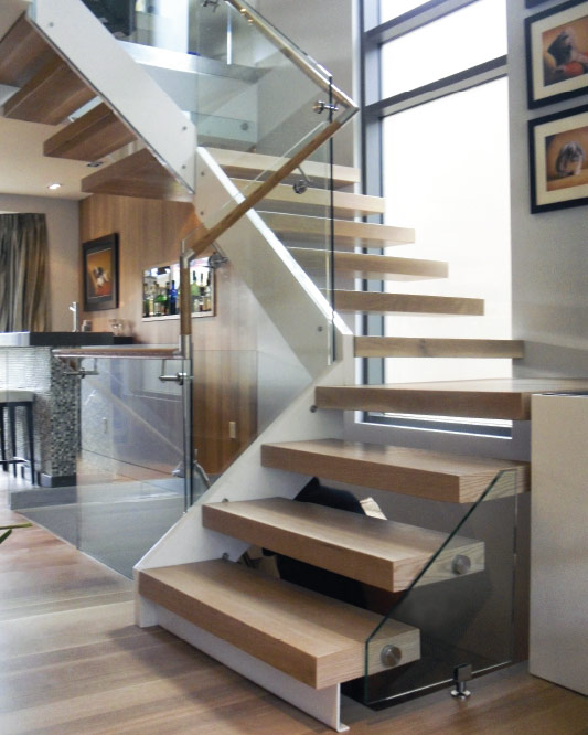 stringer cantilevered / box steps / oak box landing / glass side mount handrail / round wood handrail