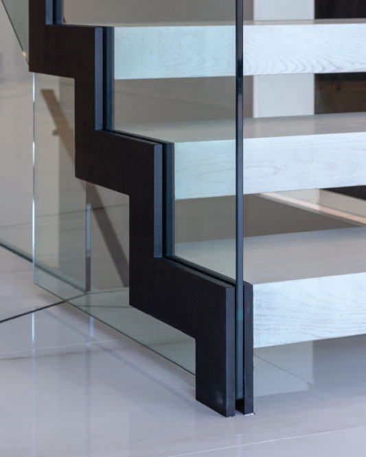 zig-zag and cantilevered stair / glass side mount handrail / rectangular painted aluminum handrails